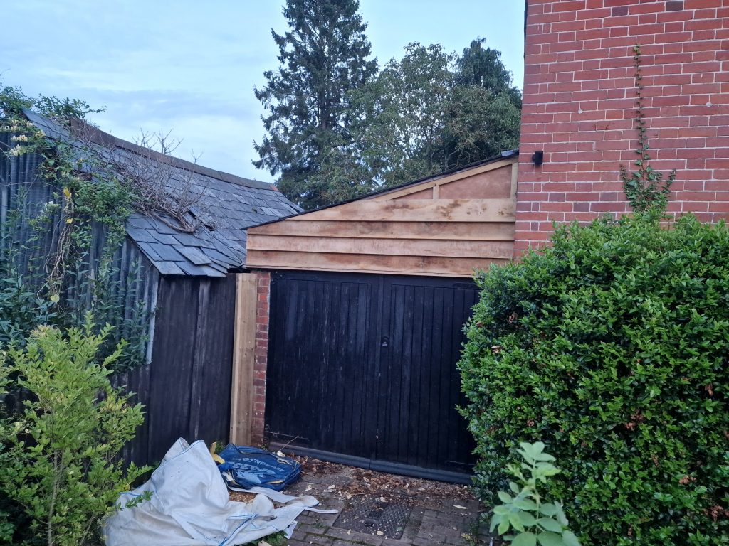 Oak feather edge cladding on garage in the New Forest, Cadnam